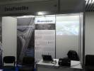 Empty DataFomSky booth with posters at DronItaly 2014